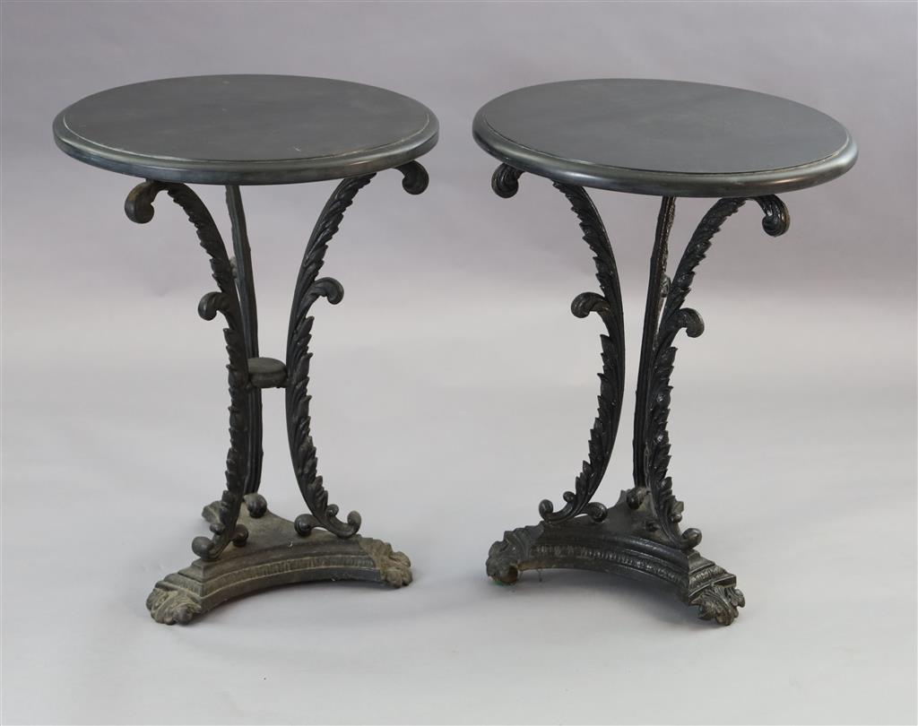 A pair of early Victorian cast iron occasional tables, Diam. 1ft 9in. H.2ft 4in.